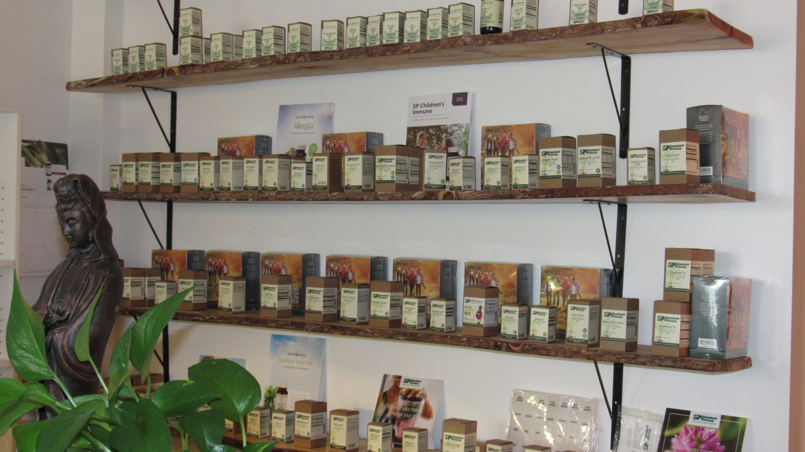 Standard Process and MediHerb supplements on the selves at Bahan Natural Health Center in Lakewood, Ohio.